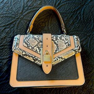 Tan Aldo handbag with snakeskin detail. Can be a crossbody
Like new
